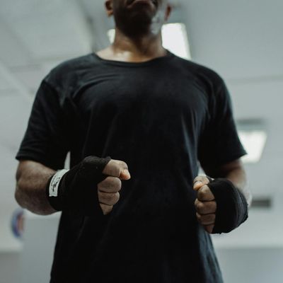 Hands wrapped in training straps, showing readiness.